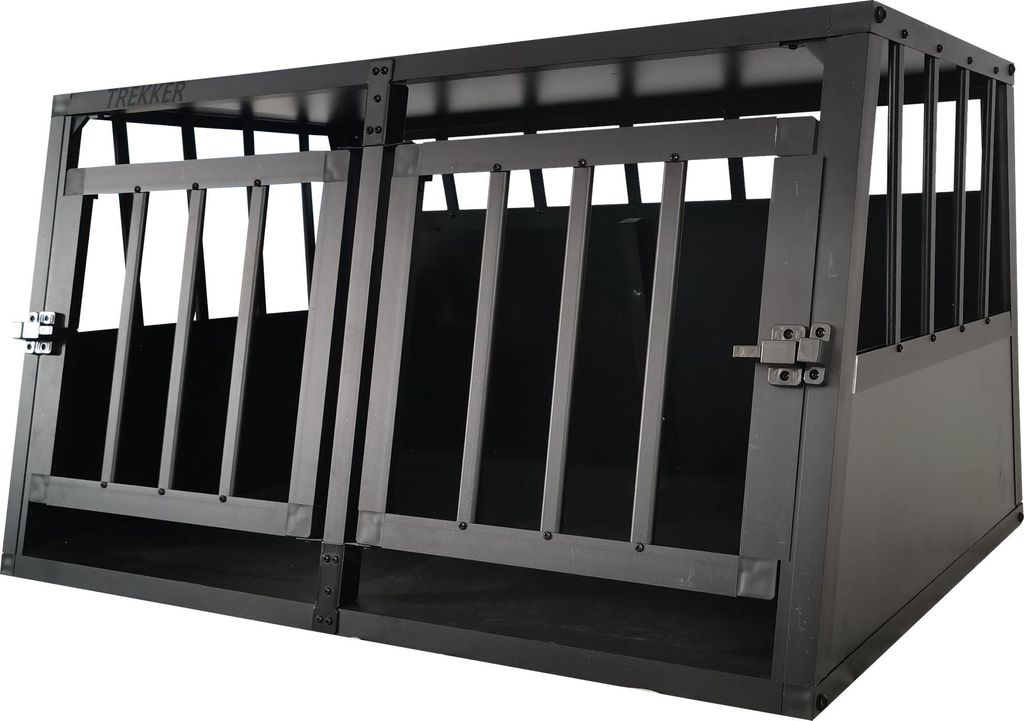 A black metal dog crate with two compartments.