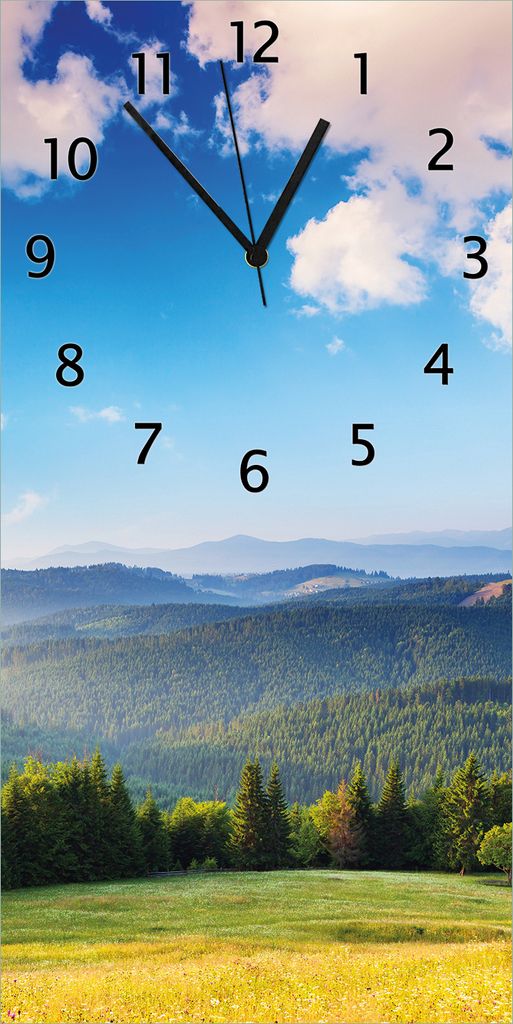 Wallario Design Wanduhr bedruckt, Größe 30 x 60 cm, Motiv: Berglandschaft im Gebirge unter blauem Himmel