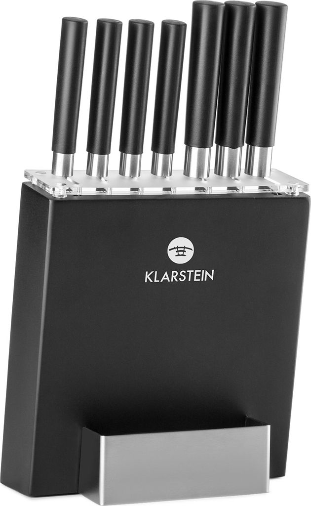 A set of kitchen knives in a black block.