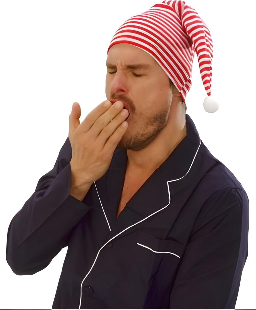 A man wearing a striped nightcap and pajamas yawns.