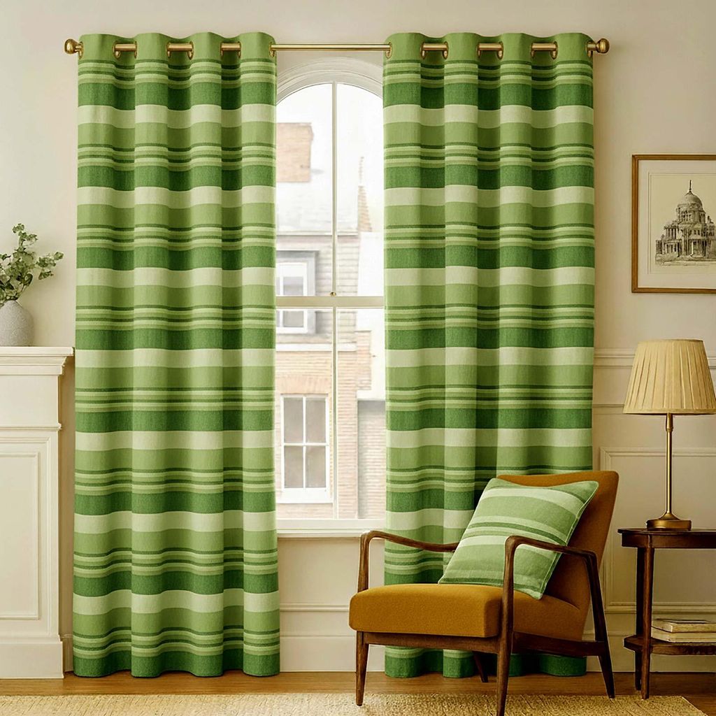A living room scene with green striped curtains framing a window, a chair with a cushion, and a side table with a lamp.
