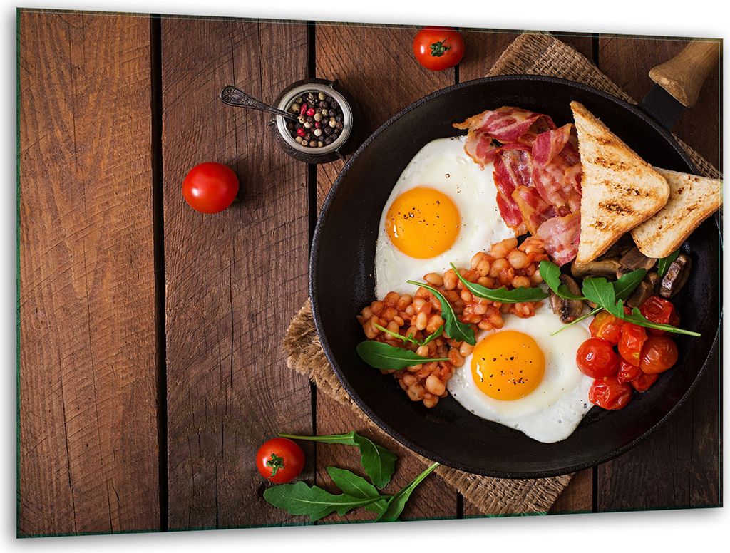 A cooked breakfast is served on a wooden table.