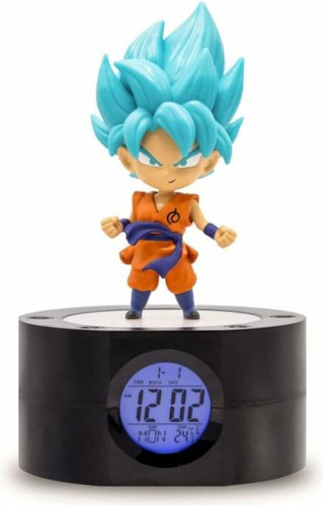 A figurine of Goku from Dragon Ball standing on a digital alarm clock.