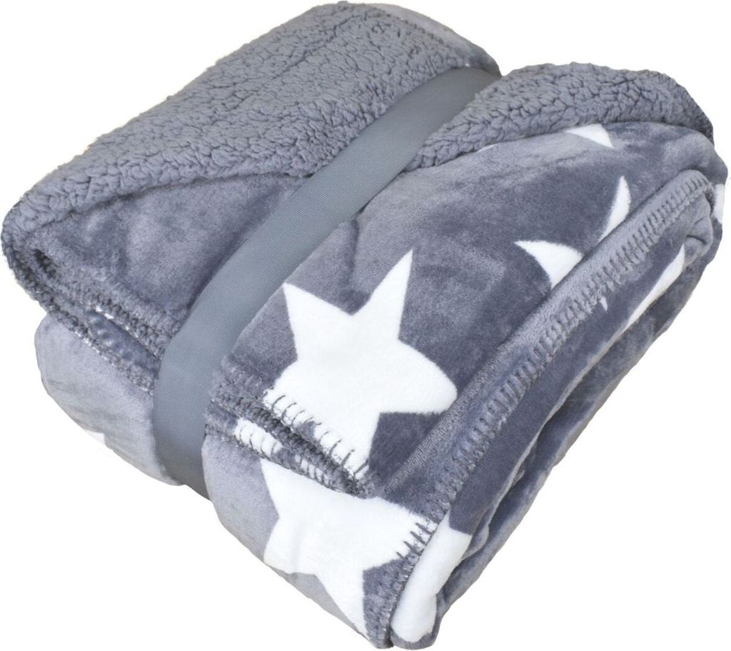 A folded gray blanket with white stars and a sherpa lining, held together by a gray strap.