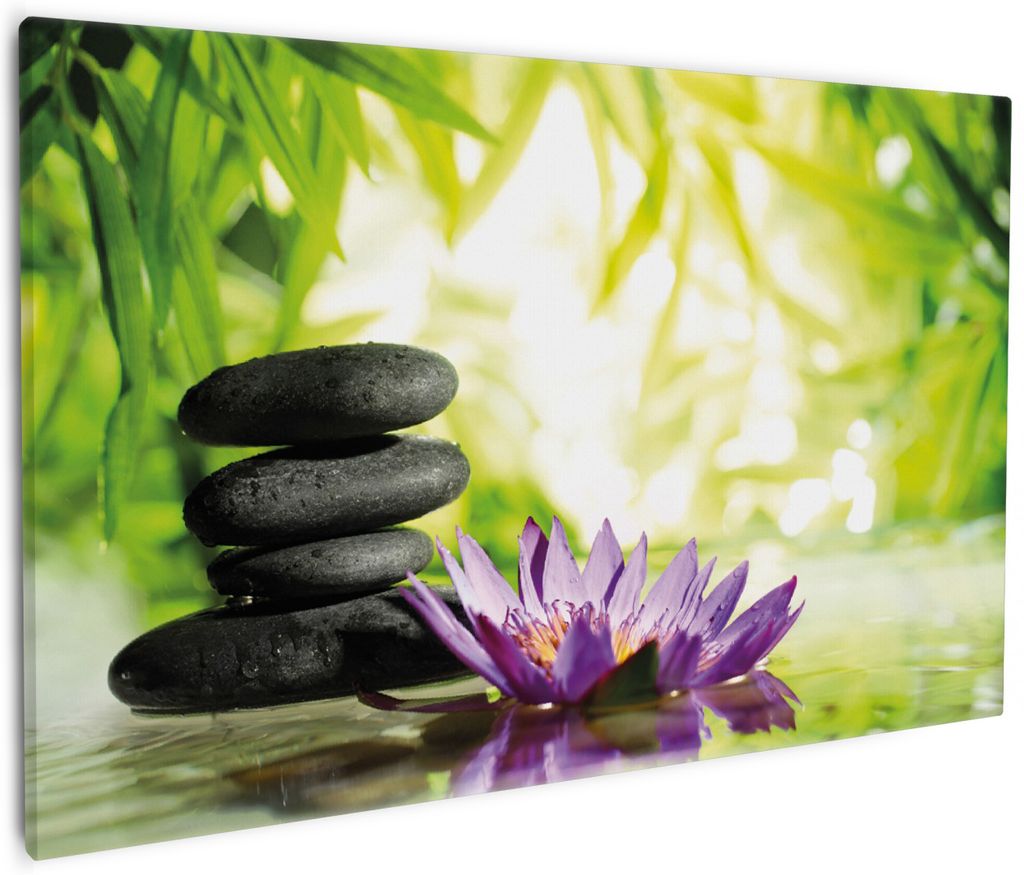 Wallario Premium Leinwandbild Steinstapel in schwarz mit Blumenblüte in lila in Größe 60 x 90 cm