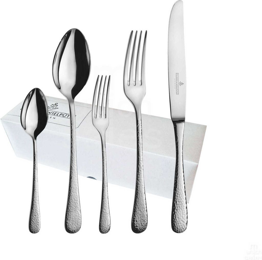 A set of cutlery arranged on top of a white box.