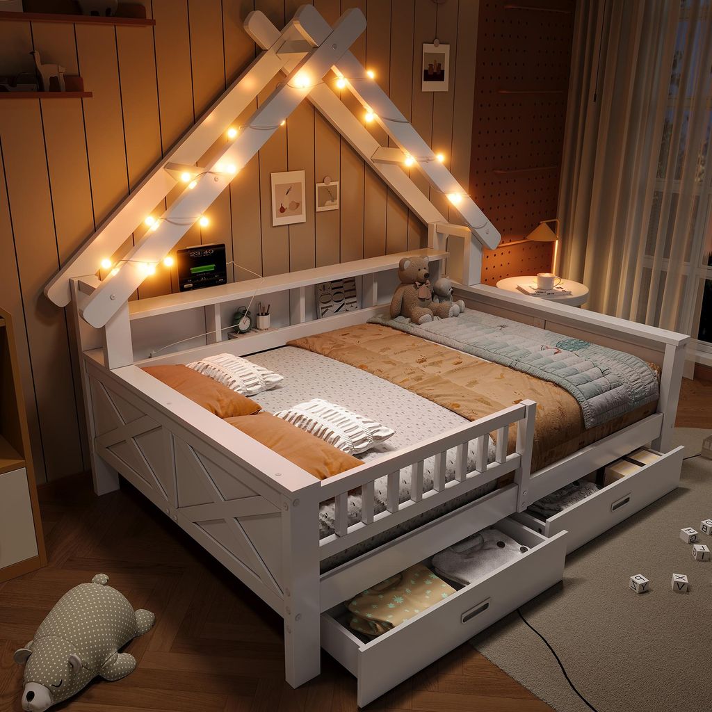 A child's bed with a house-shaped frame and LED lights, decorated with pillows and a teddy bear.