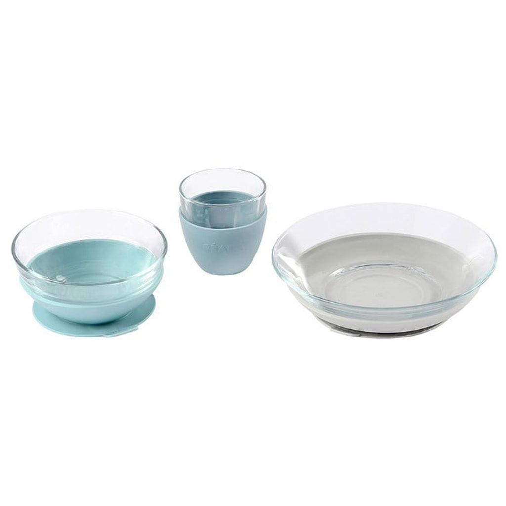 A set of baby dishes including a bowl, a cup, and a plate, arranged on a white background.
