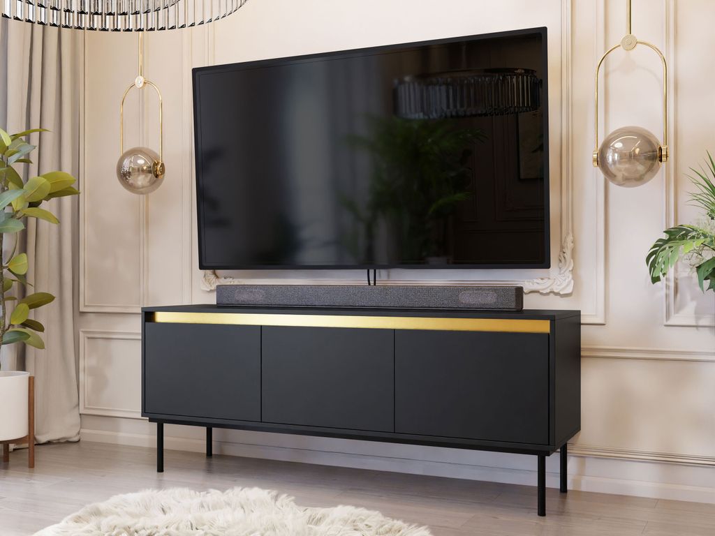 A modern living room with a TV stand and television.