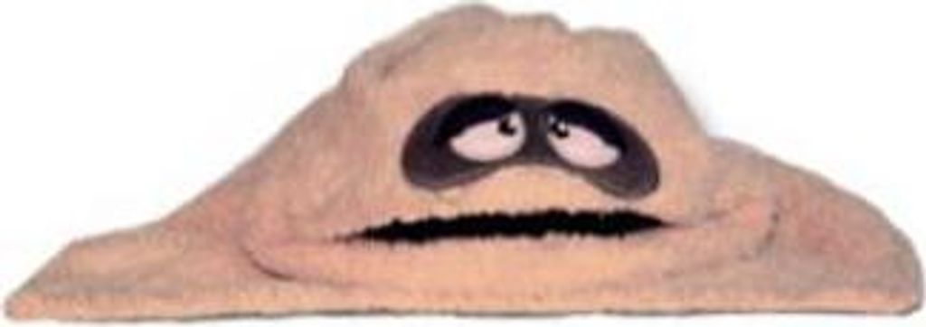 A puppet with a beige body, black eyes, and a black mouth against a white background.