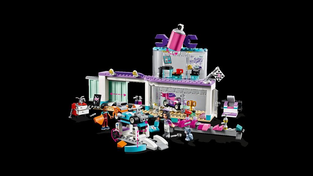 A LEGO Friends Tuning Workshop playset is displayed against a black background.