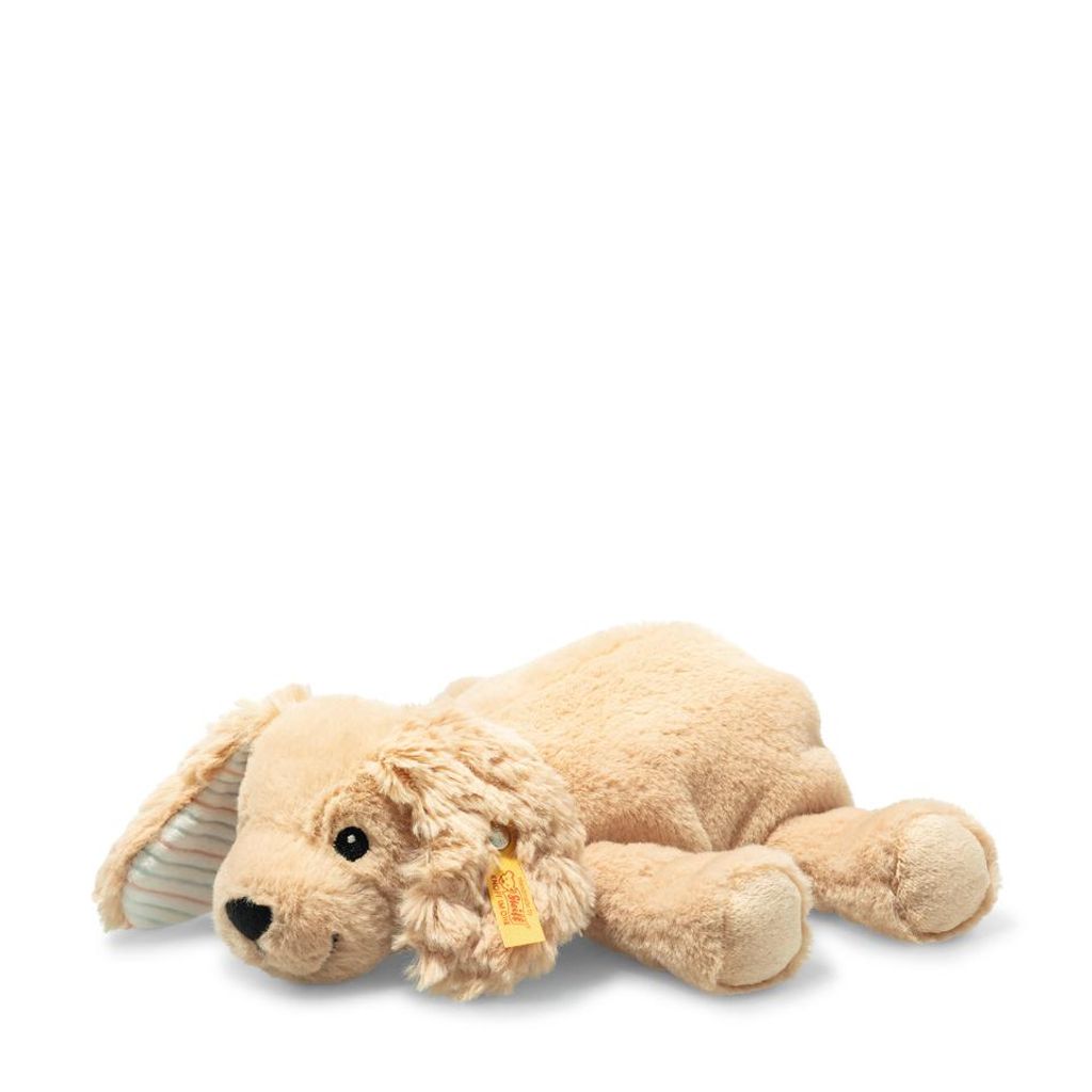 A plush toy dog lying down on a white background.