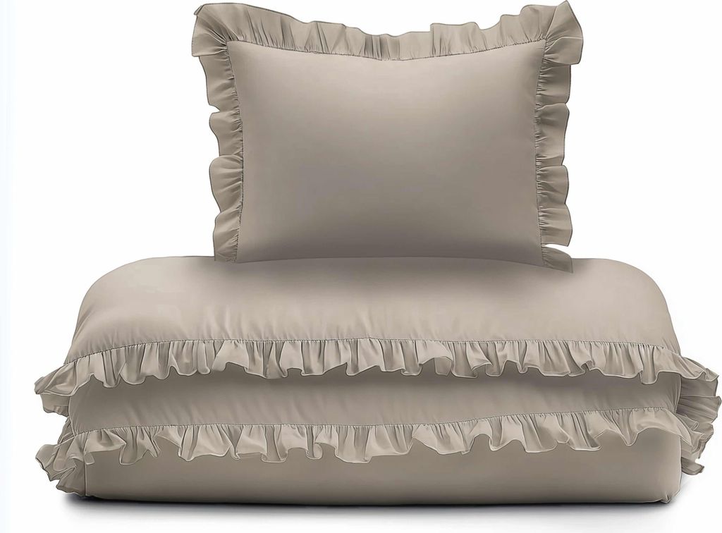 A stack of taupe bedding with ruffles, including a pillow and a duvet or comforter.