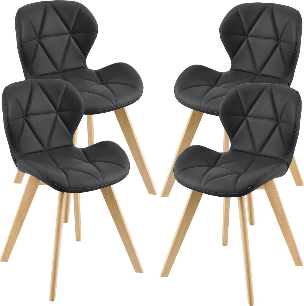 Four black chairs with wooden legs are arranged in a studio setting against a white background.
