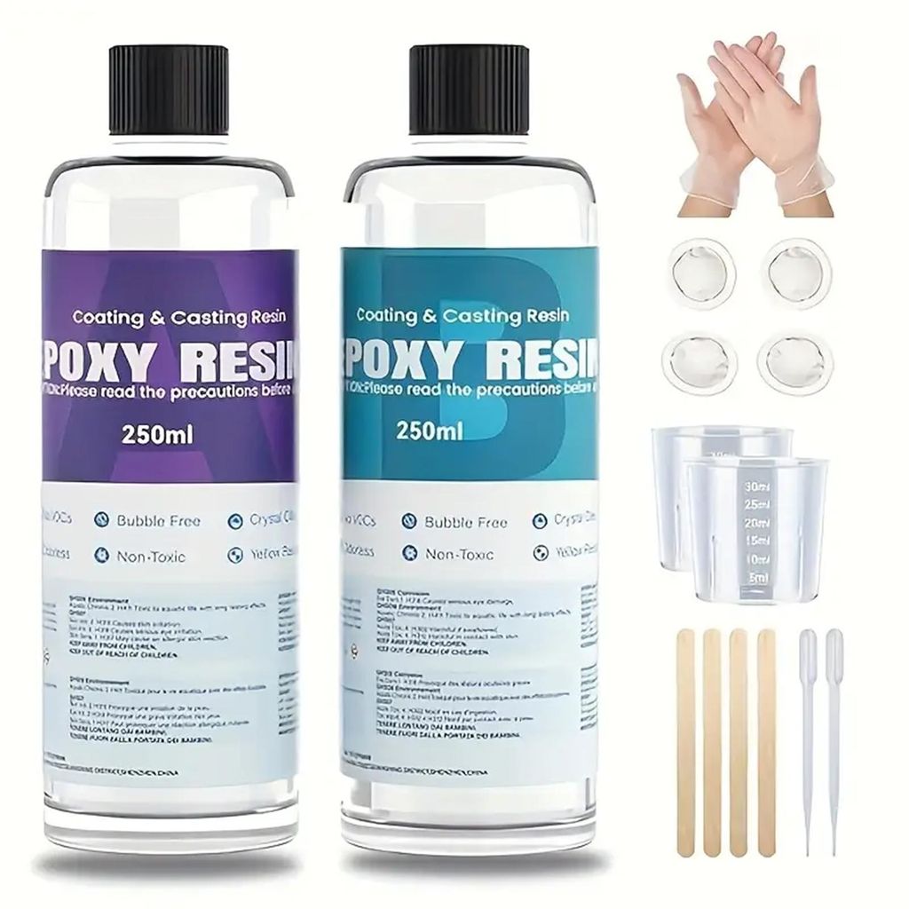 Two bottles of epoxy resin and various accessories for crafting.