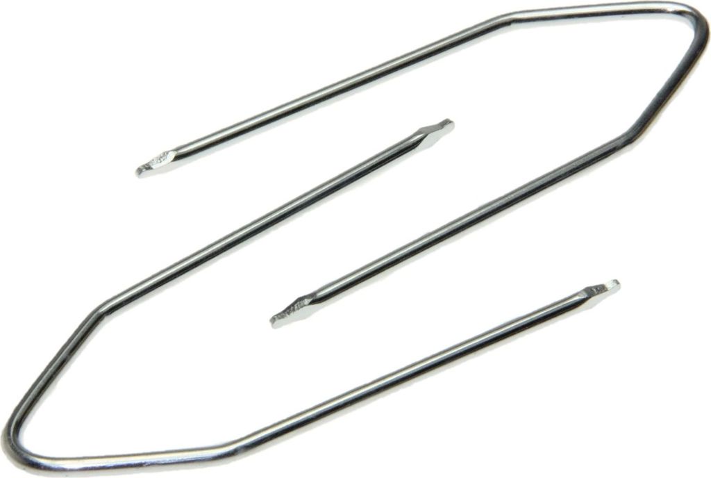 A set of metal car stereo removal tools on a white background.