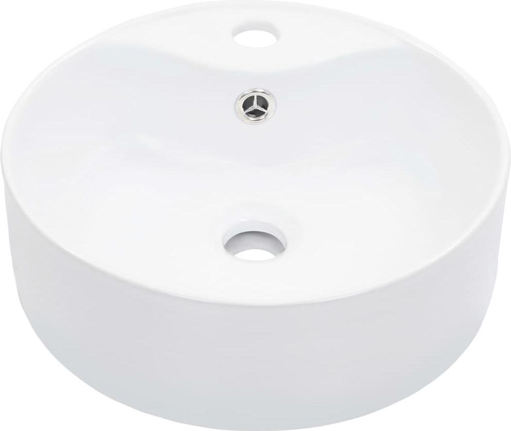 A white ceramic sink with two holes and a drain.