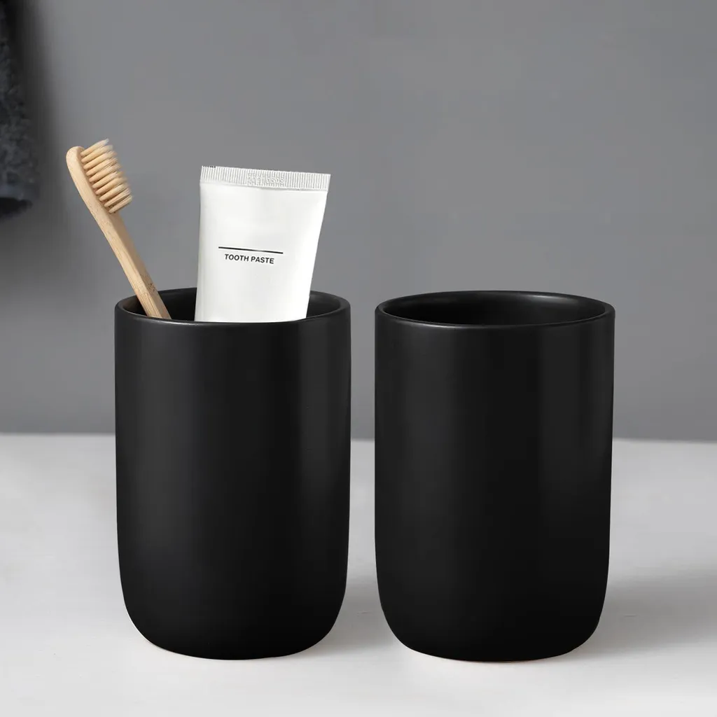 Porte-brosse à dents stable en céramique noir contre le désordre