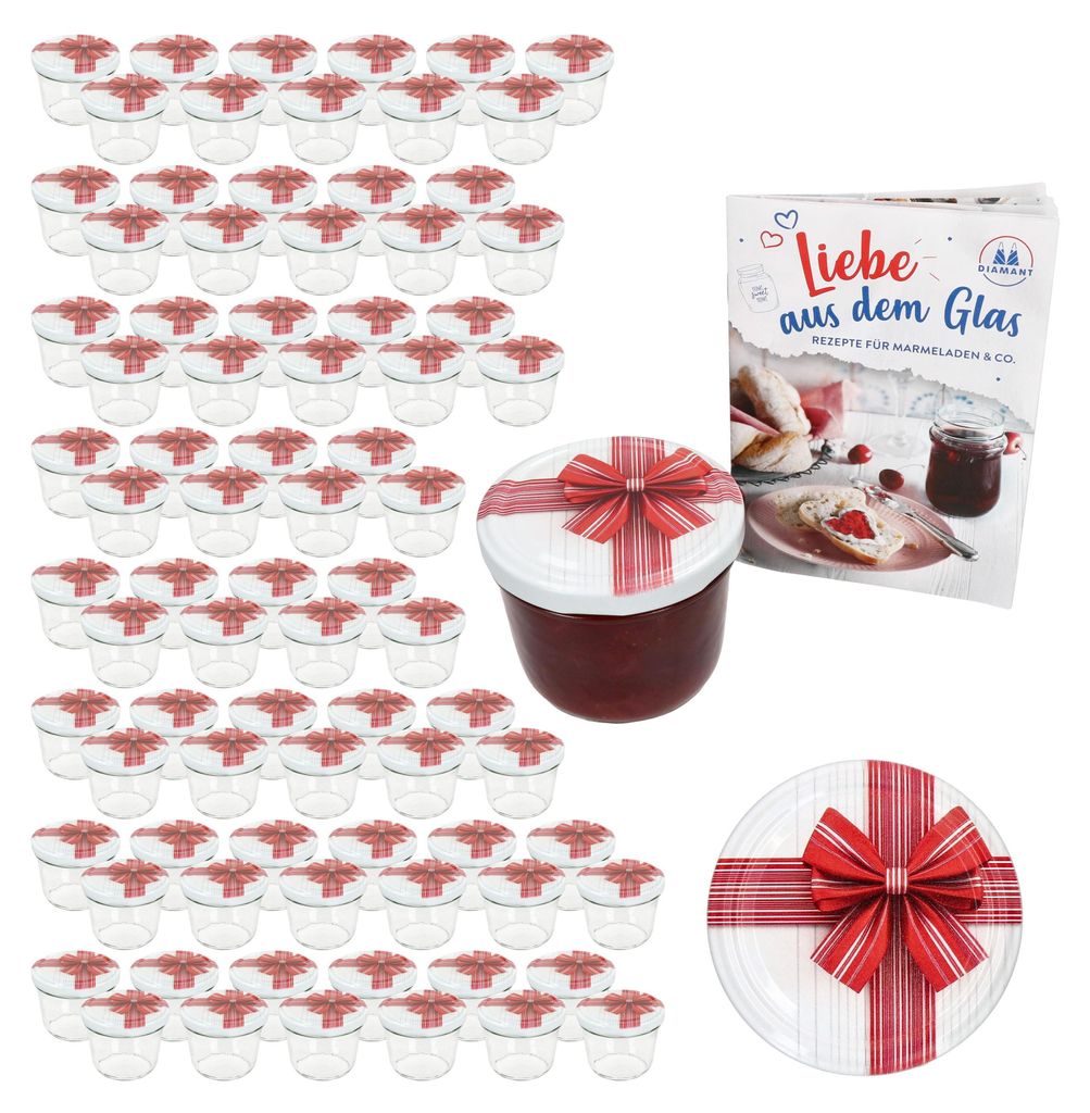 A set of small glass jars with red and white striped lids decorated with red bows, a cookbook, and a decorative plate, all presented as a gift set.