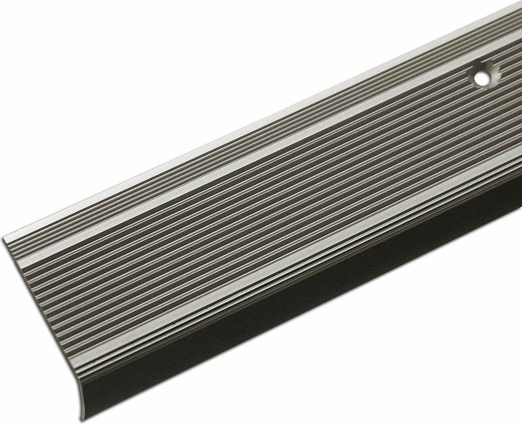 A close-up, angled view of a silver-colored metal stair nosing profile with a black rubber insert, set against a white background.