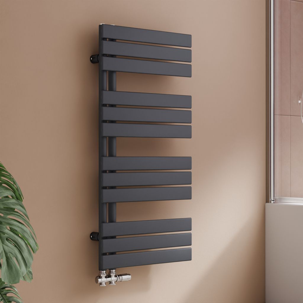 A modern anthracite radiator in a bathroom setting.