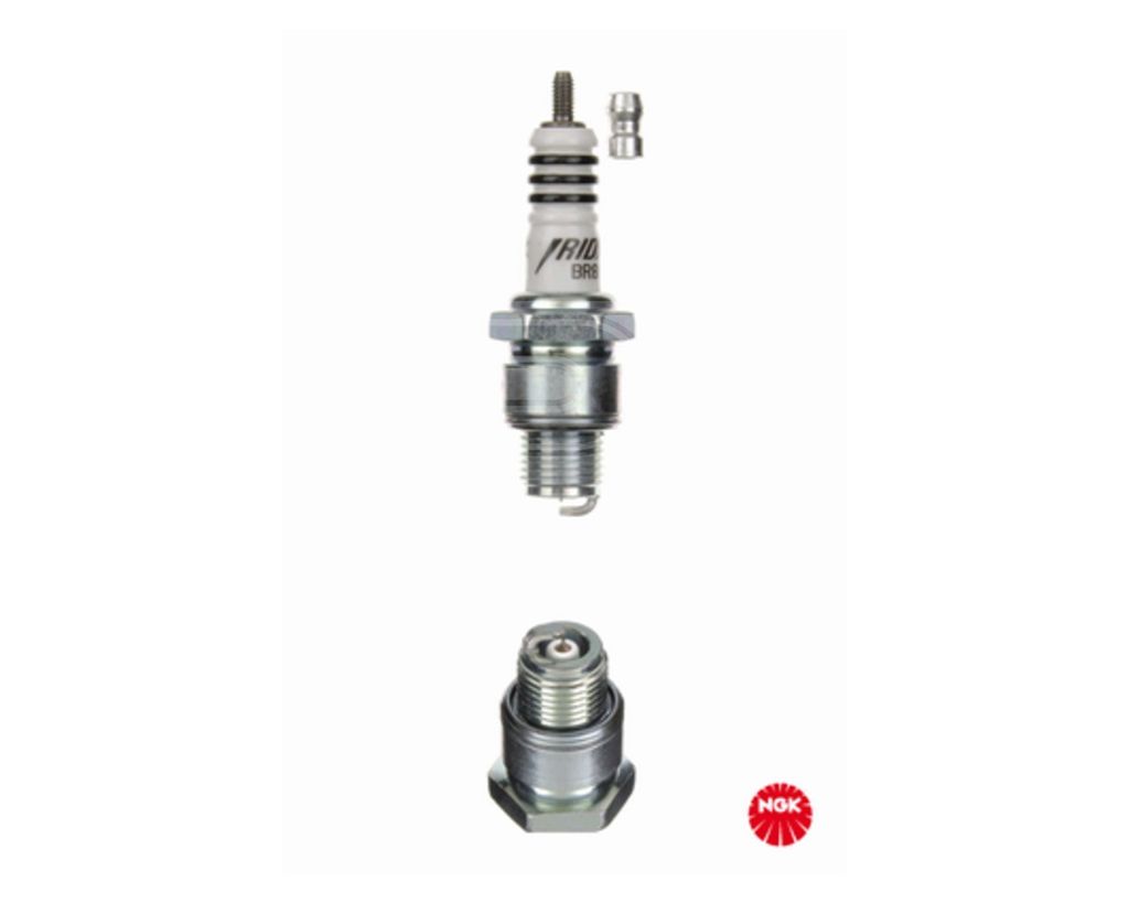 A product shot of a spark plug and its components against a white background.