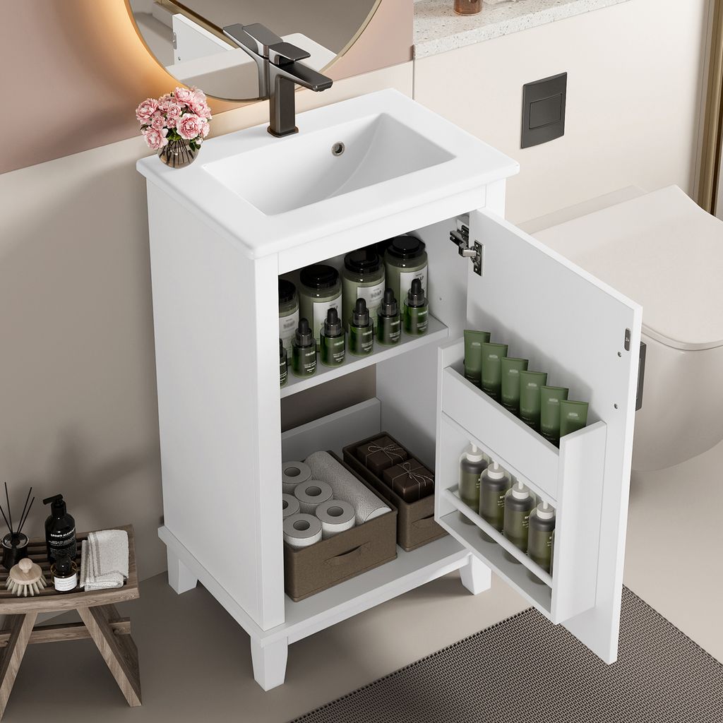 A white freestanding bathroom cabinet with an integrated ceramic sink and an open door revealing storage shelves with various toiletries and containers. A faucet is mounted on the sink, and a round mirror is visible in the background.