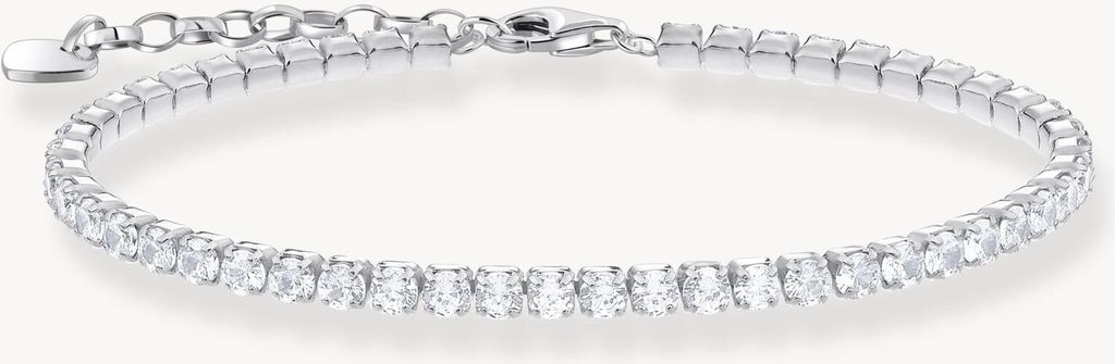A close-up studio shot of a delicate silver bracelet with clear stones.