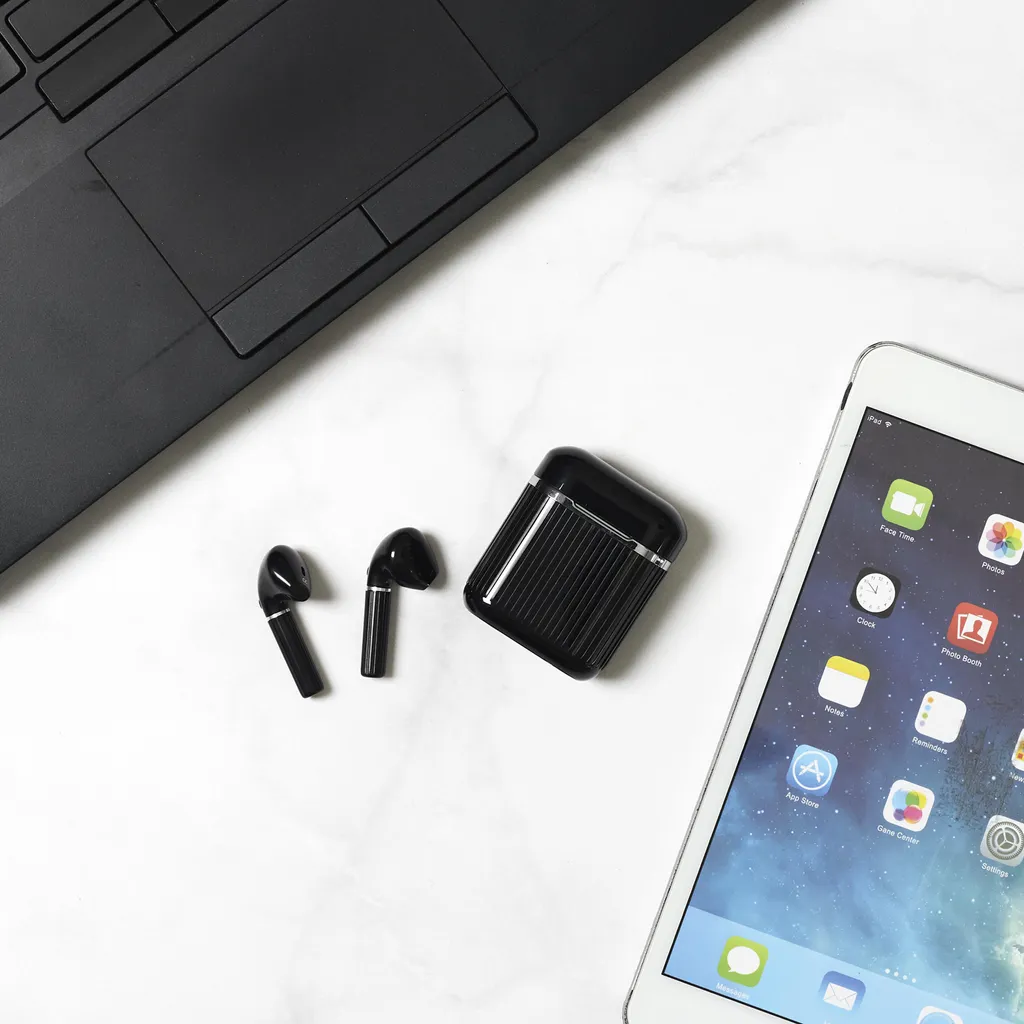 Écouteurs sans fil type boutons et boîtier de recharge nomade Earbox