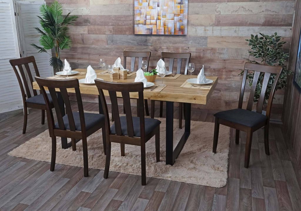 A dining room set with a wooden table and chairs.