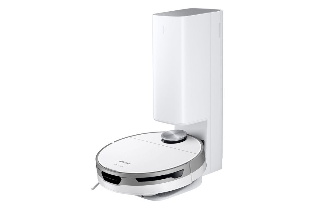 A white robot vacuum cleaner is docked in its charging station against a white background.
