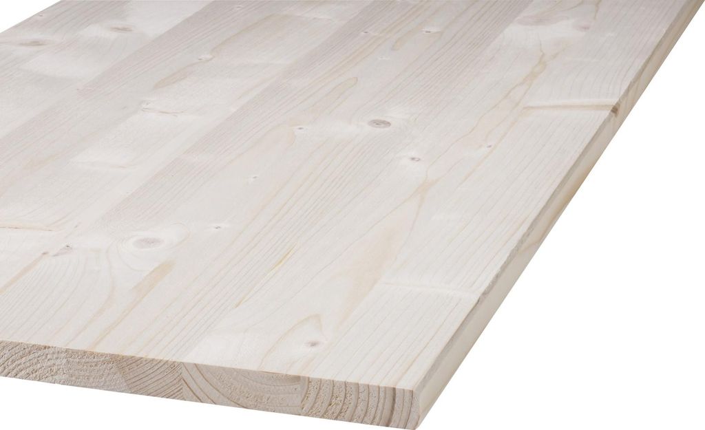 A close-up, angled view of a light-colored wooden board.