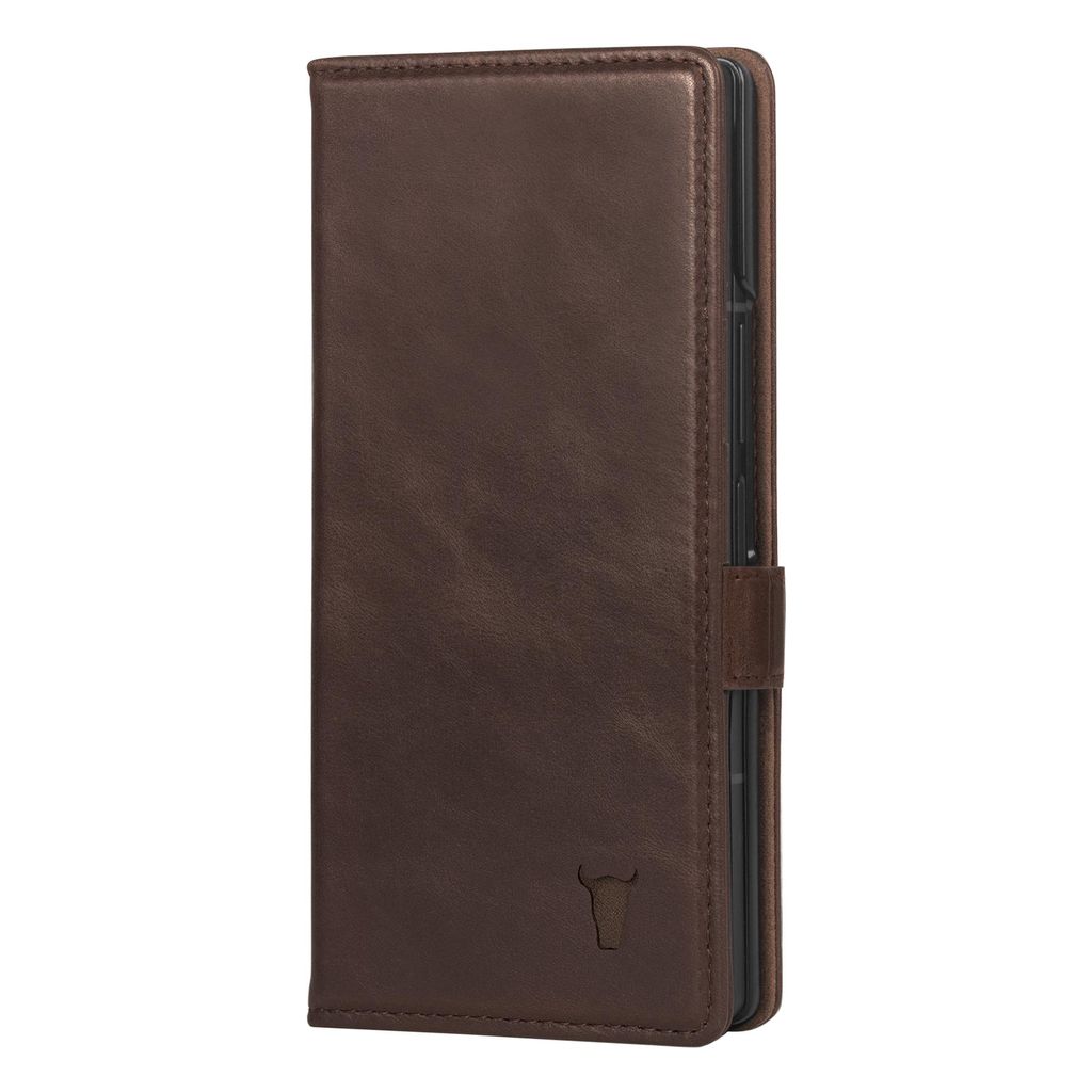 A dark brown leather phone case is shown standing upright against a white background.