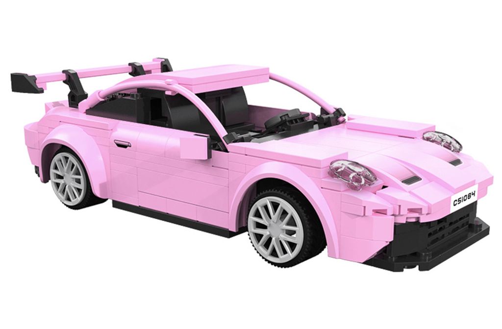 A pink toy sports car on a white background.