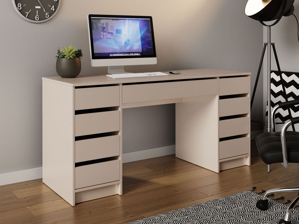 A desk with a computer and drawers in a room.