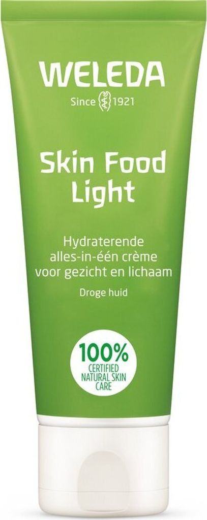 A green tube of Weleda Skin Food Light cream with white text and a white cap.