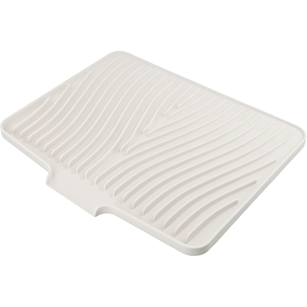 A white silicone dish drying mat with a wavy pattern.
