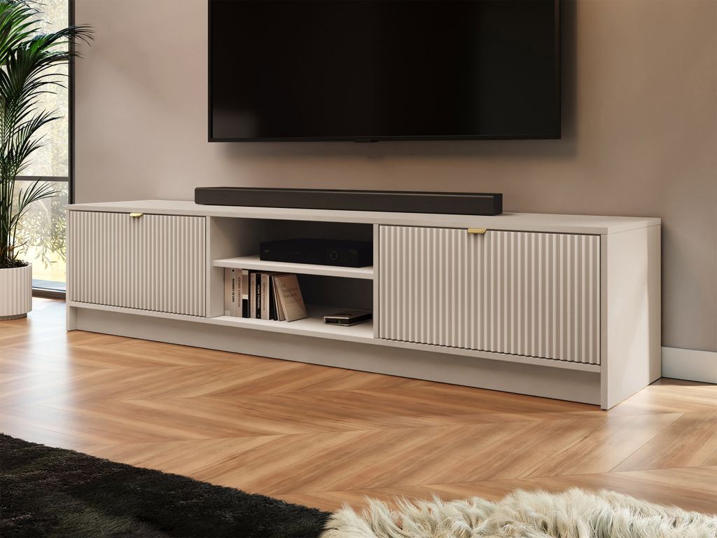 A modern living room with a TV and entertainment center.