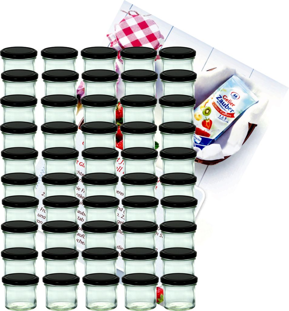 A large group of small glass jars with black lids, arranged in rows, with a packet of jelly powder and a checkered cloth in the background.