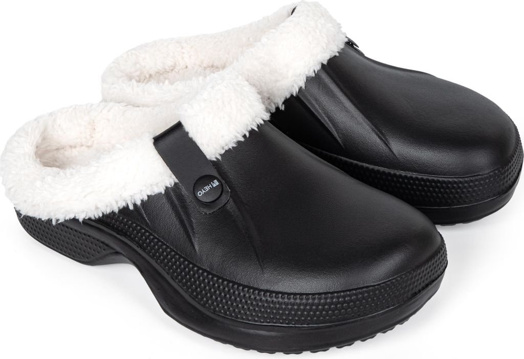 A pair of black clogs with white fluffy lining.
