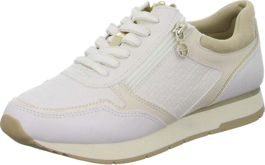 A single white and beige Tamaris women's sneaker is shown from a side angle against a white background.
