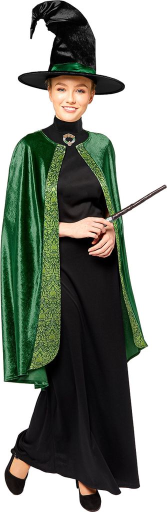 A woman dressed as a witch, holding a wand.