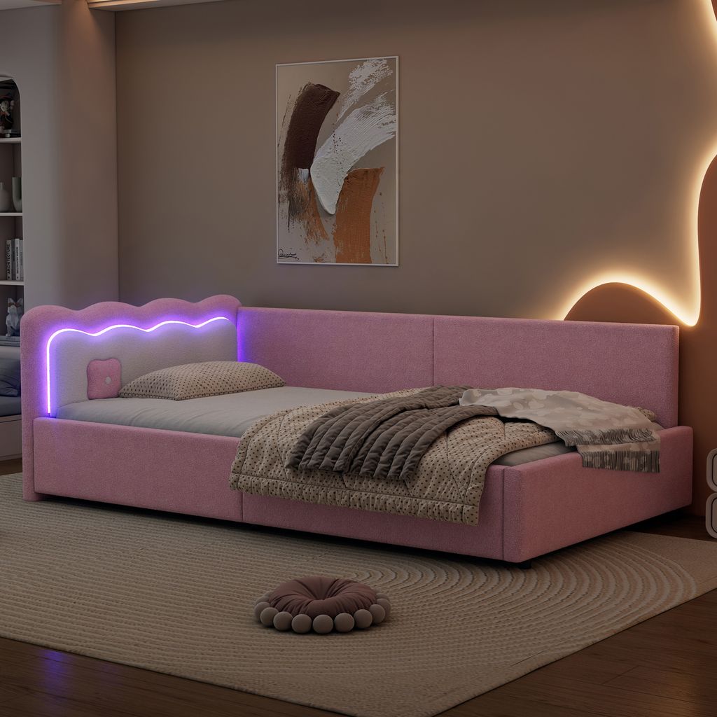 A pink upholstered daybed with LED lighting in a bedroom setting.