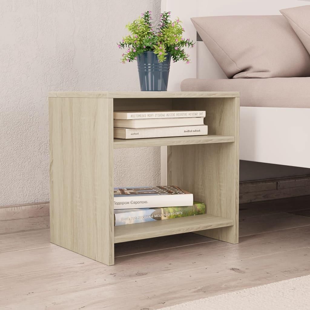 A wooden nightstand with two shelves, placed next to a bed. There is a potted plant on top of the nightstand.