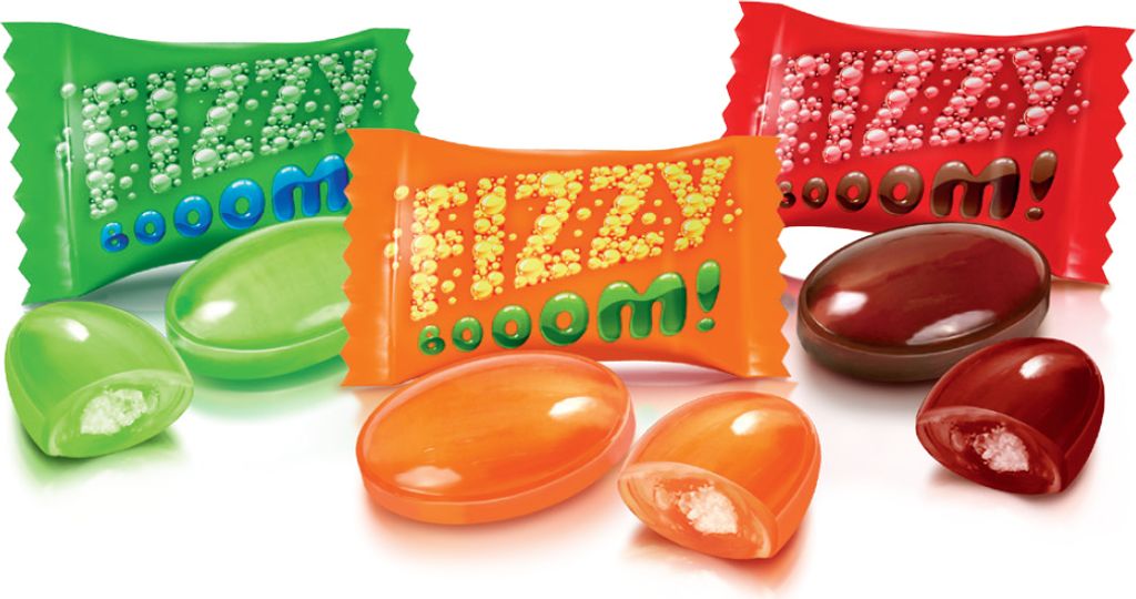 A studio shot of assorted candies and their wrappers.