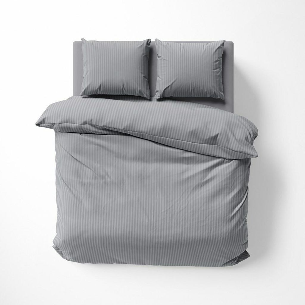 A top-down view of a gray striped duvet and two pillows on a bed.