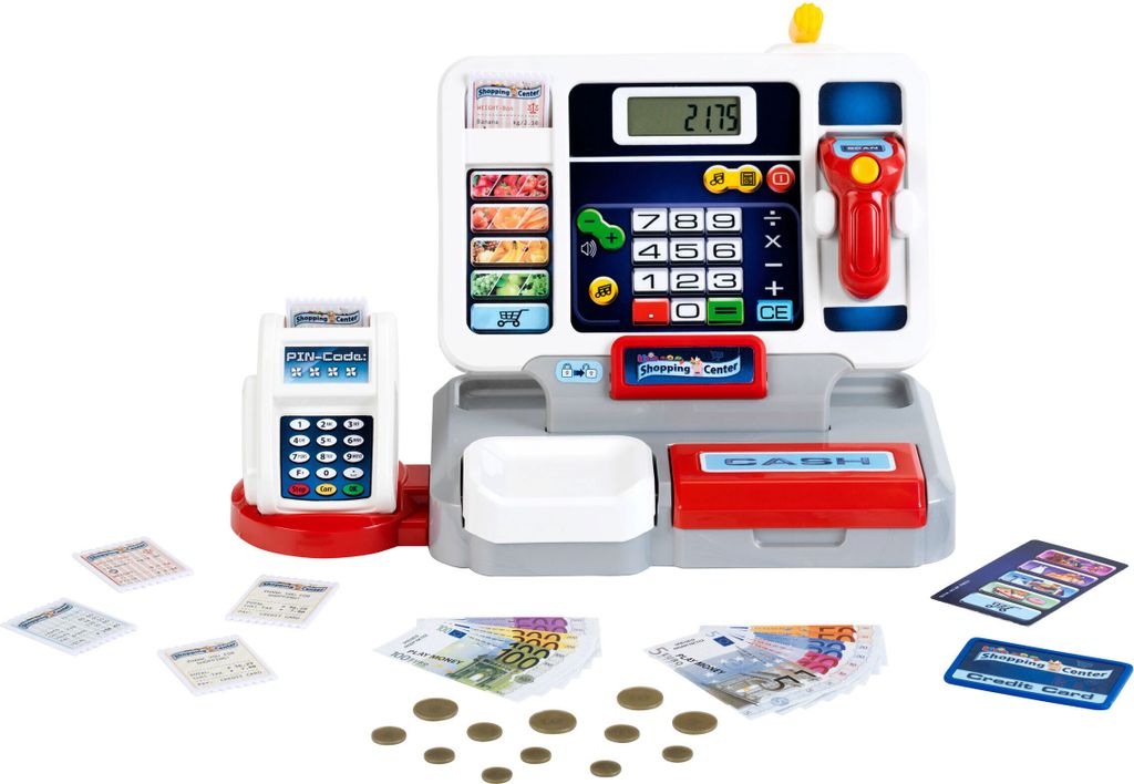 A toy cash register with accessories like play money and cards, set against a white background.