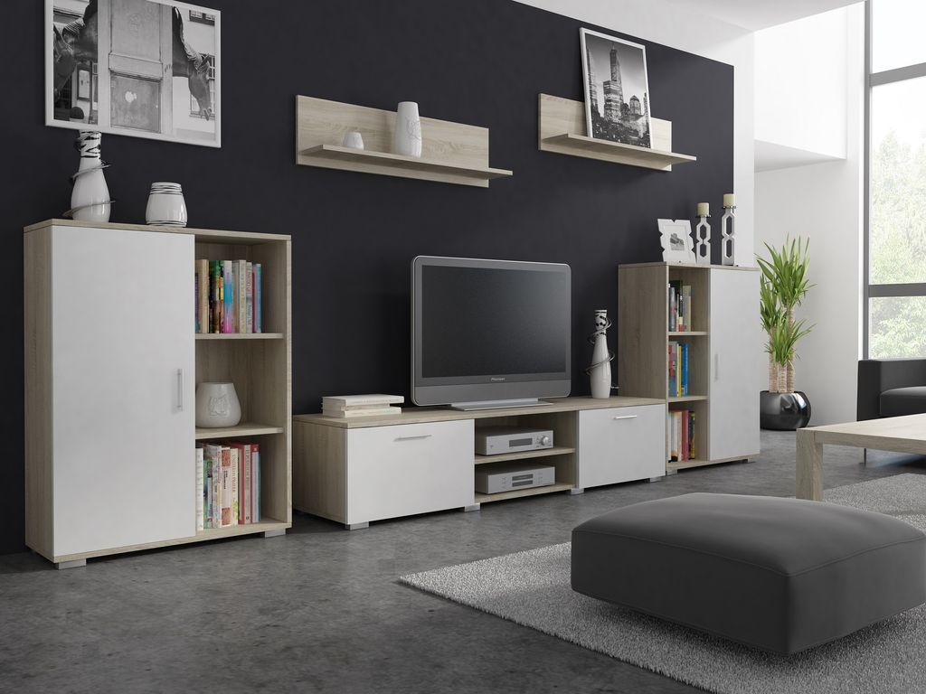 A modern living room setup featuring a wall unit with a television, cabinets, and shelves.