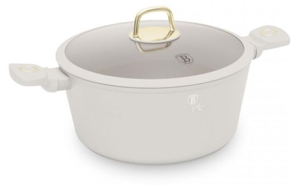 A white pot with a glass lid and gold accents, presented on a white background.
