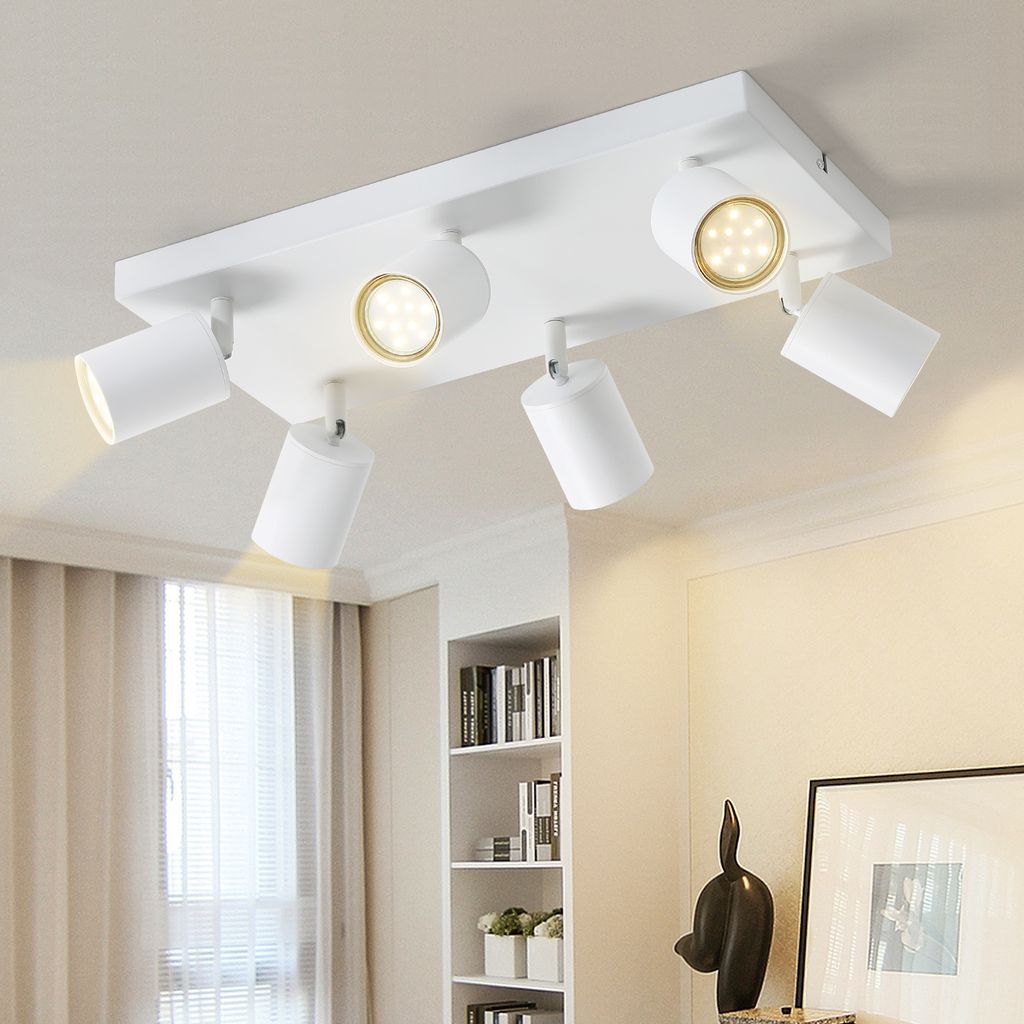 A white ceiling light fixture with multiple adjustable spotlights.